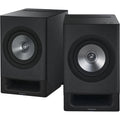 Technics SC-CX700 active bookshelf speakers with sleek black finish and modern design, showcasing their compact, stylish audio setup.