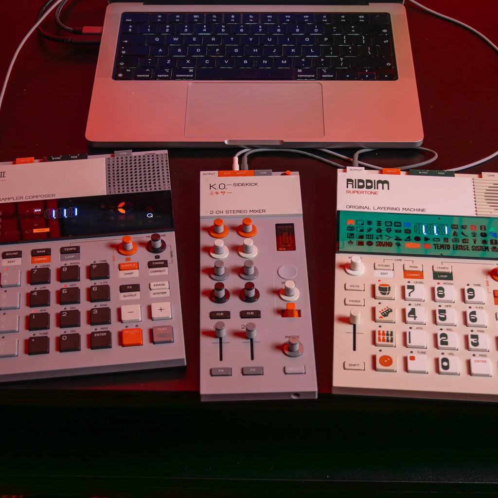 Teenage Engineering EP-136 K.O. Sidekick DJ mixer with multiple knobs, sliders, and input ports for professional audio mixing.
