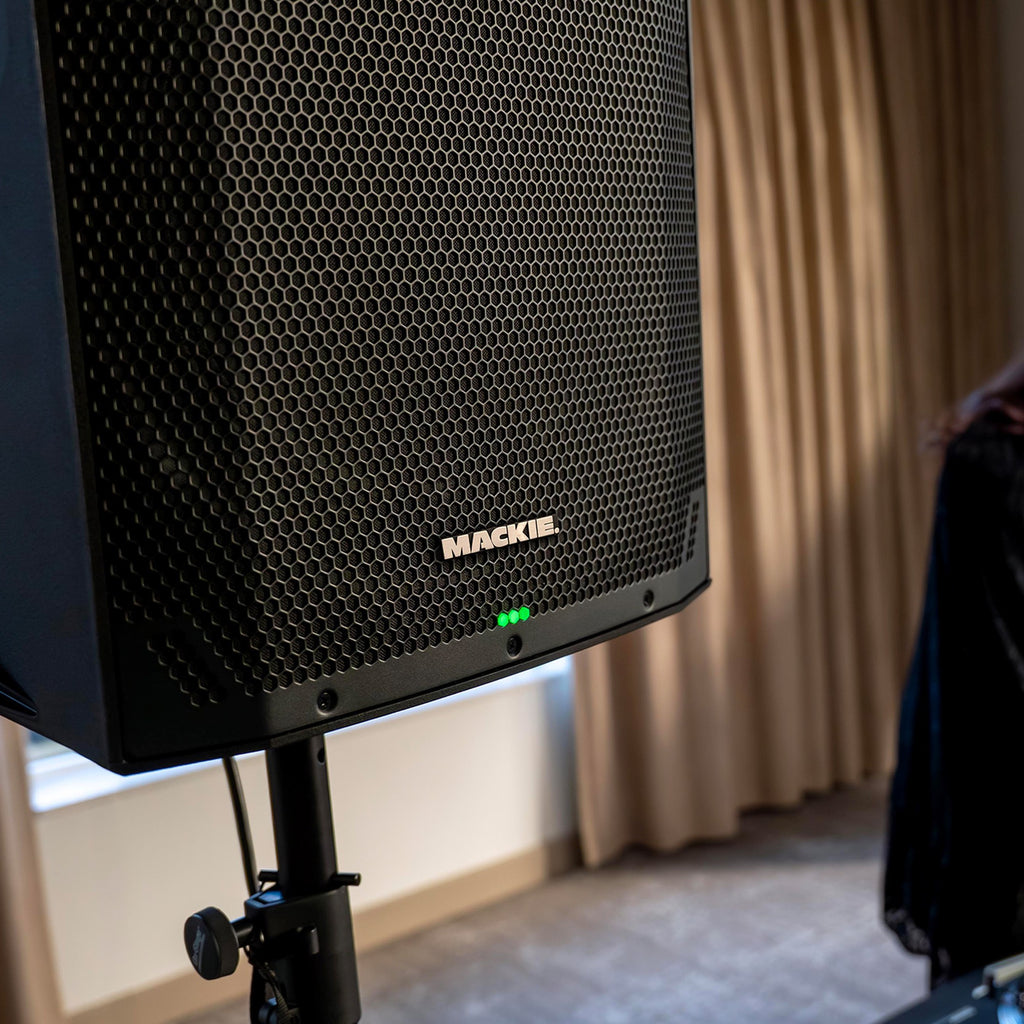 Mackie Thump12v4 active loudspeaker with rugged black enclosure and front grille, designed for high-performance audio.