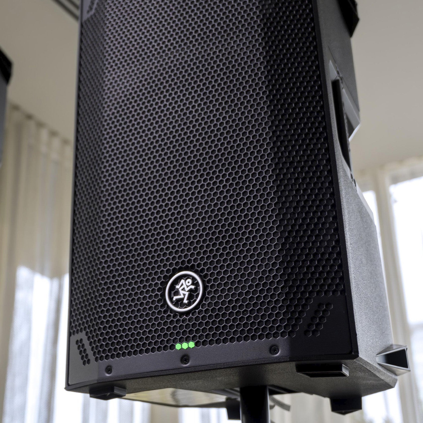 Mackie Thump12V4 active loudspeaker with a black speaker cabinet, front grille, and control panel on top.