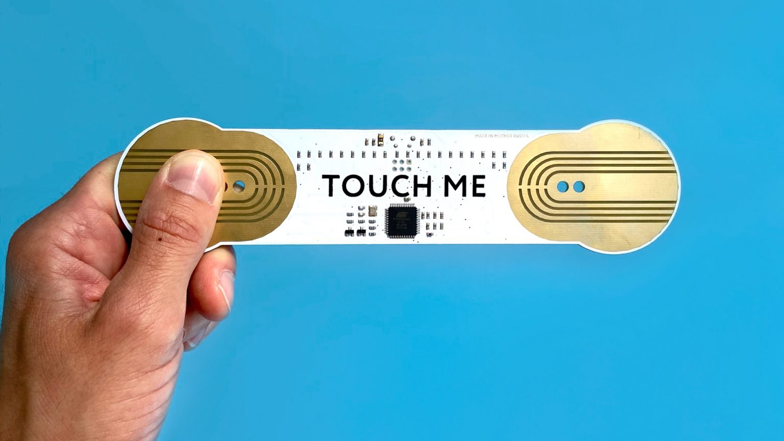 Playtronica TouchMe gadget with a sleek design, showcasing its touch-sensitive interface and modern electronic features.