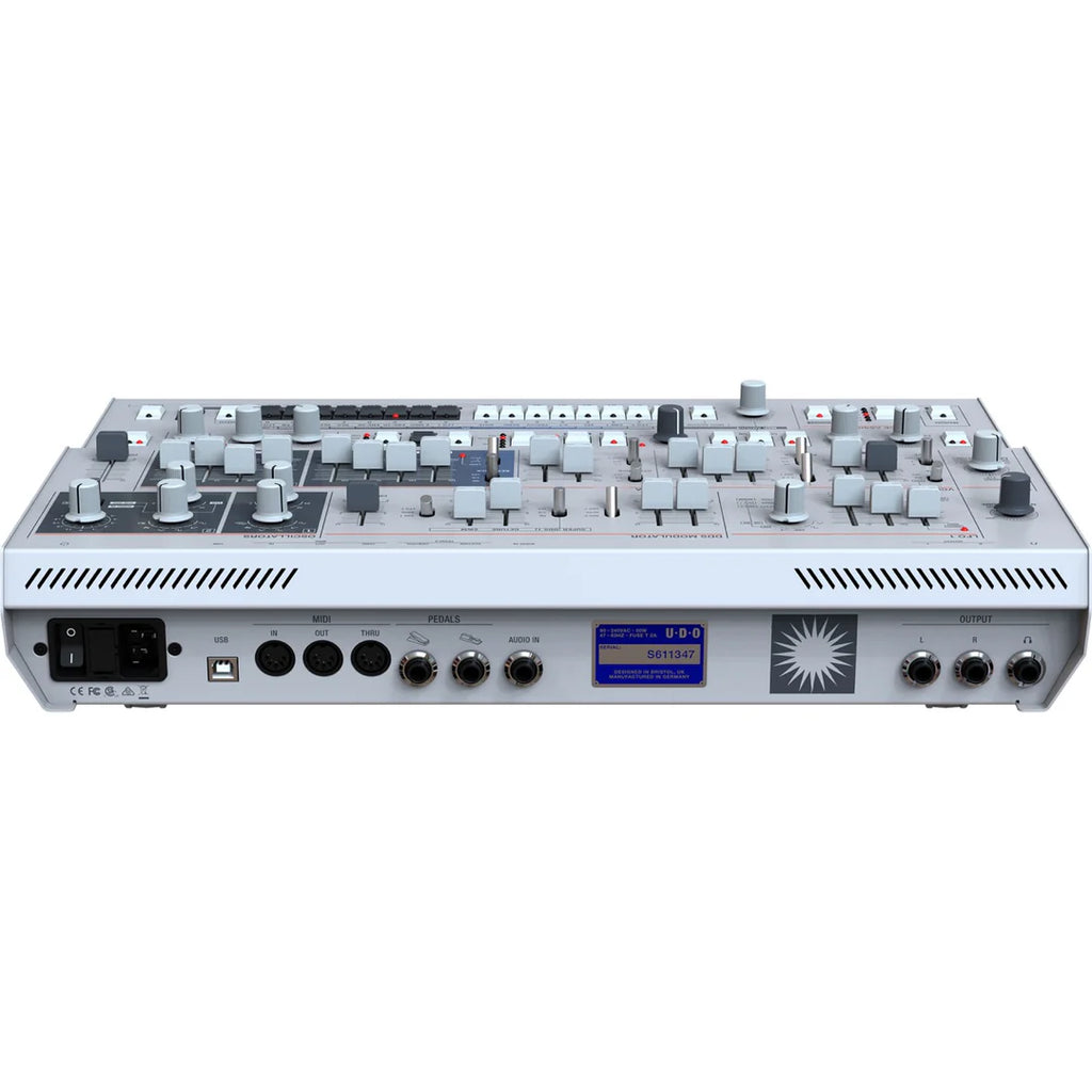 Rear top view of the UDO Audio Super 6 Desktop synthesizer showing control knobs and connection ports.