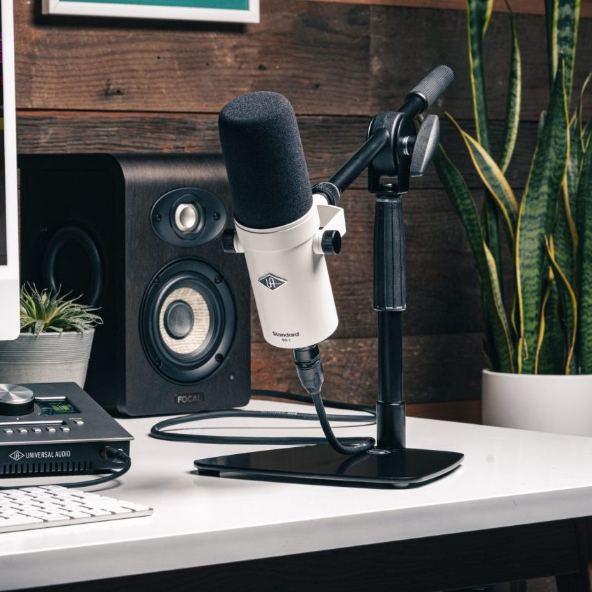 Universal Audio SD-1 dynamic microphone shown with black grille and metal body, ideal for vocals and instrument recording.