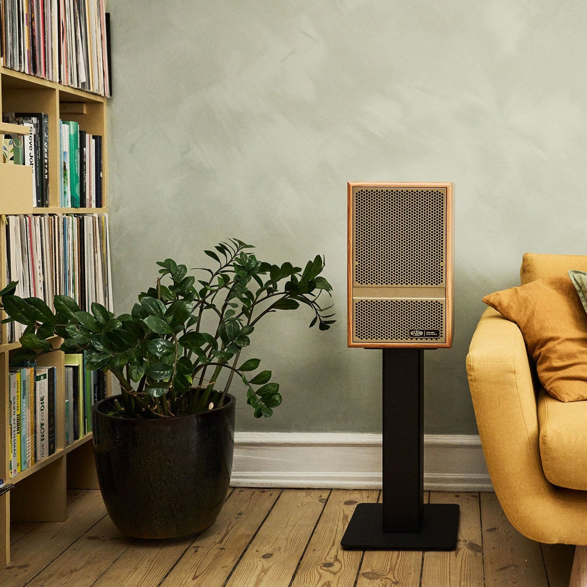 Vestlyd M-Stands holding a Vestlyd M8C Active in Oak in a living room