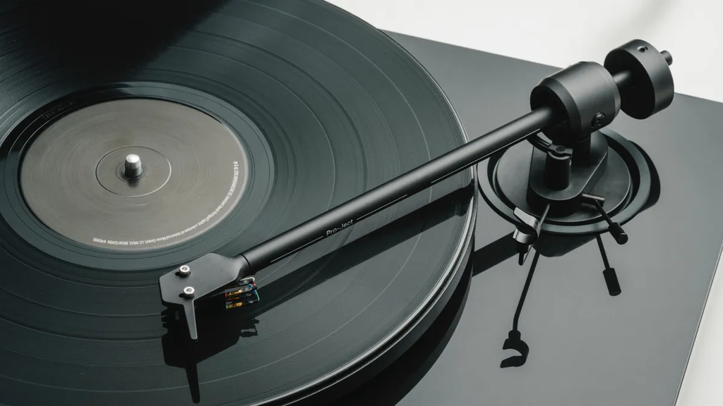 Pro-Ject E1.2 turntable with sleek design, featuring a wooden plinth and tonearm for high-quality vinyl playback.
