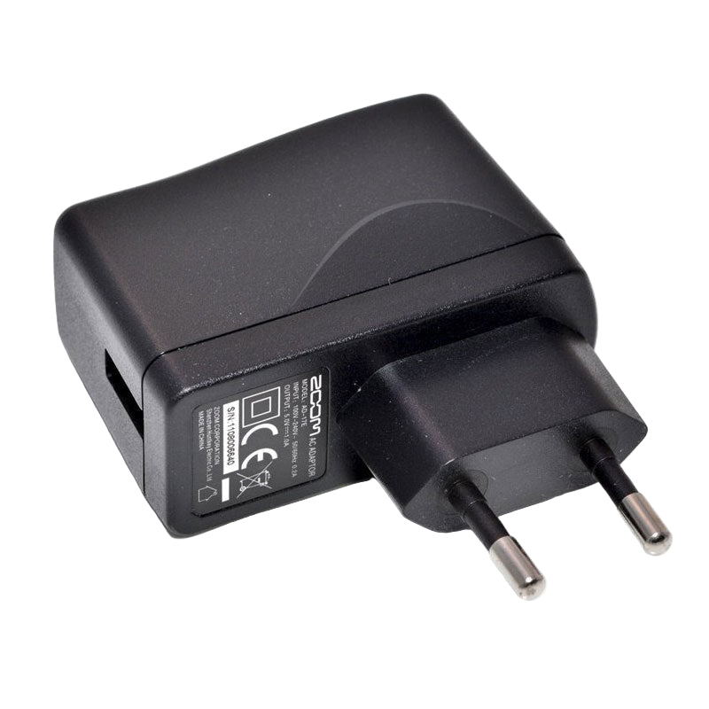 Zoom AD-17 power supply for recorder accessories, showing the compact, black power adapter with cable and plug.