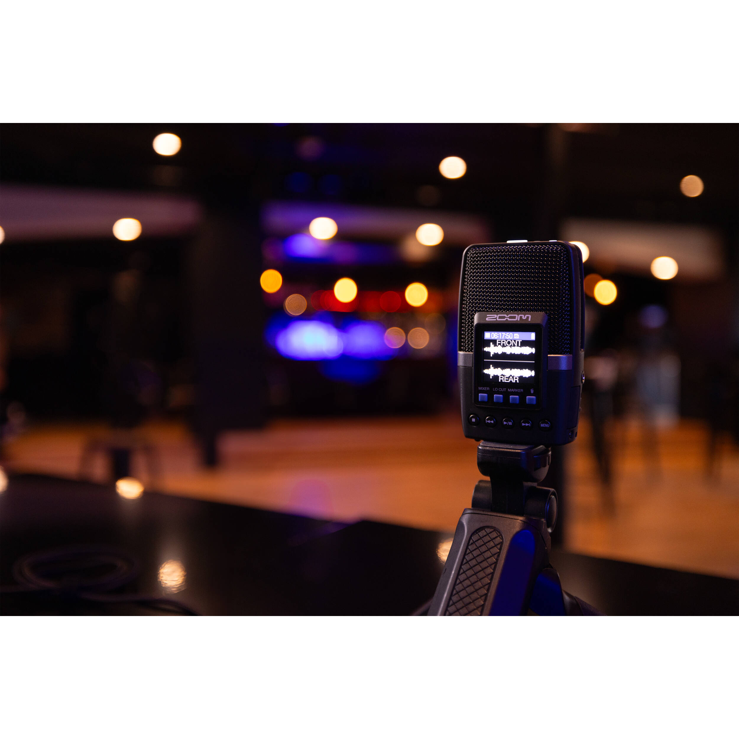 Zoom H2essential digital recorder, lifestyle on a mic stand at a venue