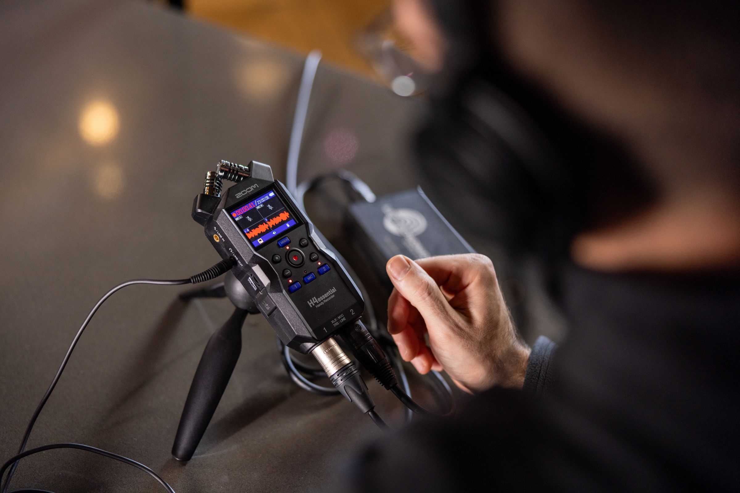 Zoom H4essential handheld audio recorder, lifestyle setup in black