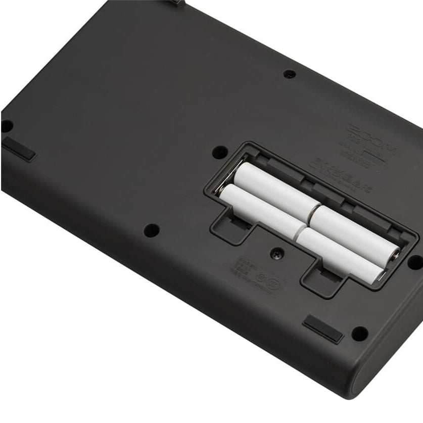 Zoom R12 digital recorder with multiple input ports, LCD screen, and control knobs for professional audio recording.